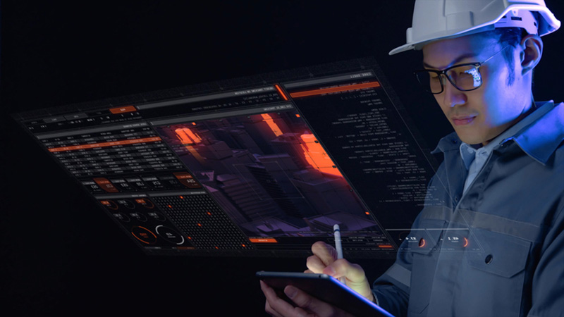 Computer engineer working in factory with laptop computer GUI graphic user interface