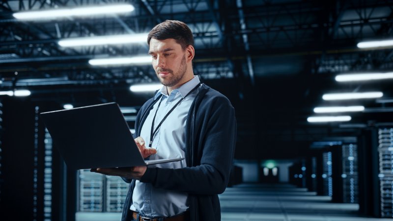 Data Center IT Specialist Using Laptop