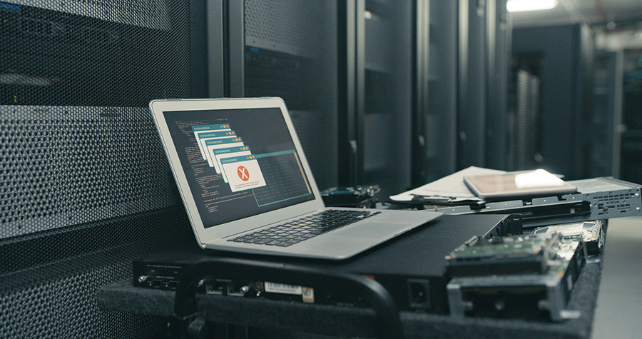 error messages on laptop in server room